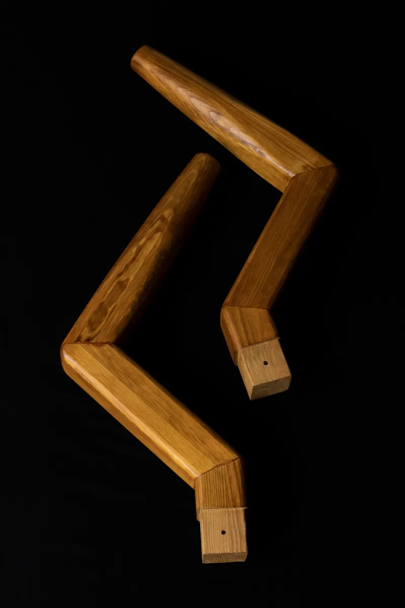 Two wooden L arms bent at 120 degrees