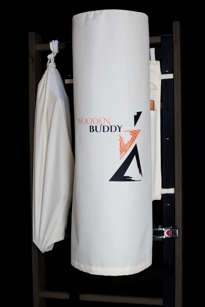Wooden Buddy covered with a white logo cover and a bag for the leg
